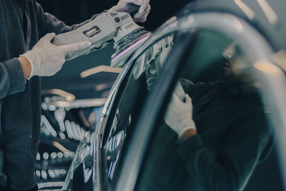 Machine polishing a vehicle's paint to remove scratches and swirls